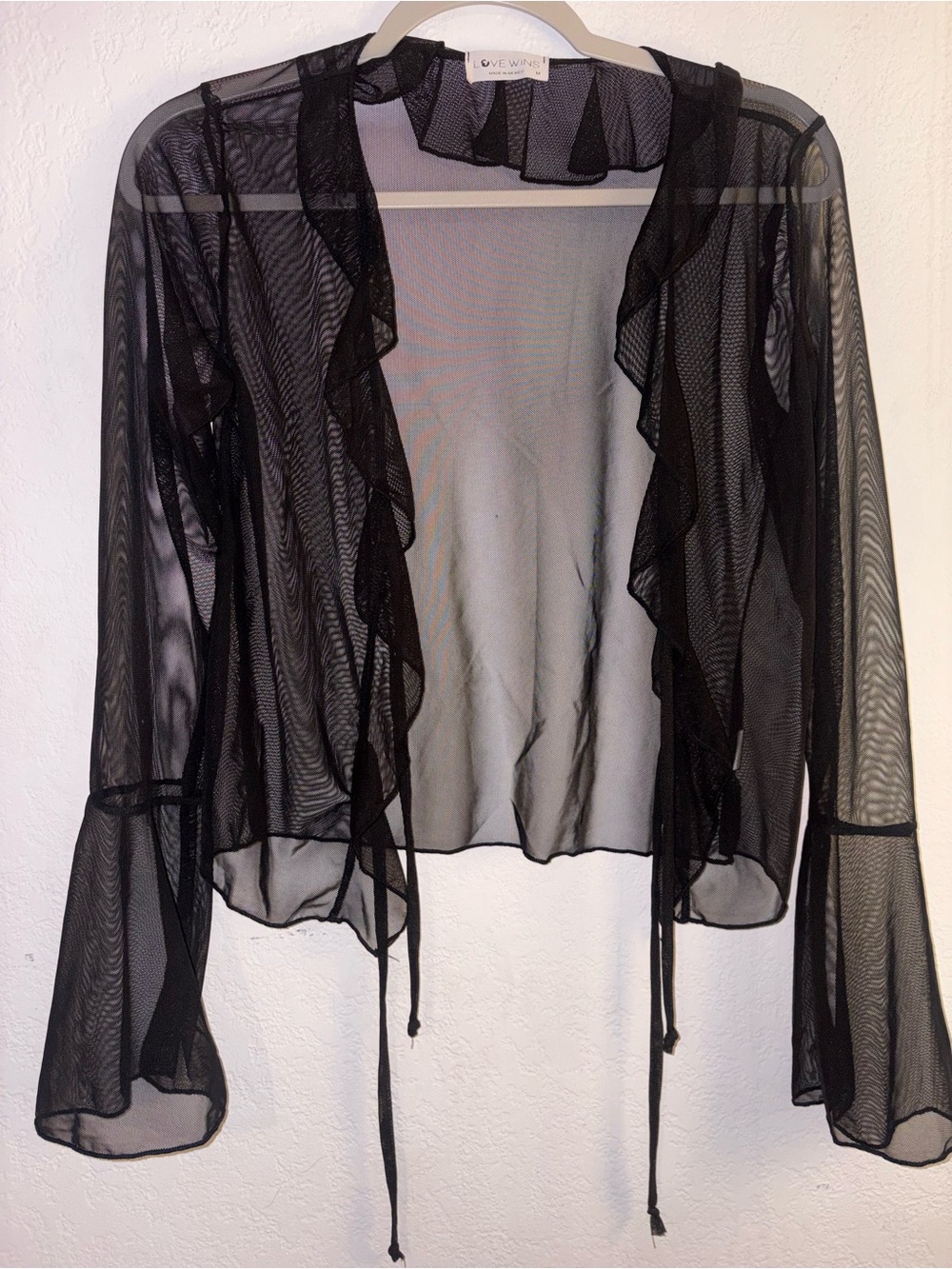 Sheer Ruffle Tie-Front Shrug in Black